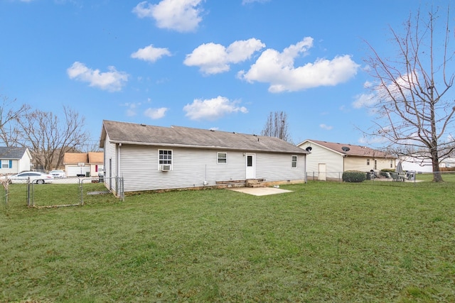 rear view of house featuring a yard and a patio