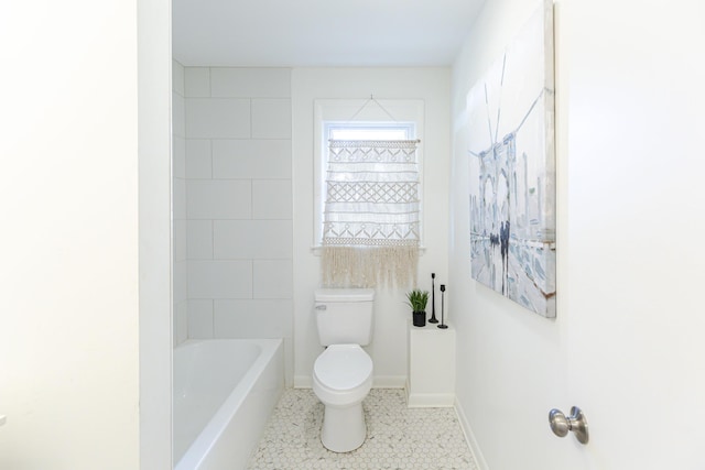 bathroom featuring tile patterned flooring,  shower combination, and toilet