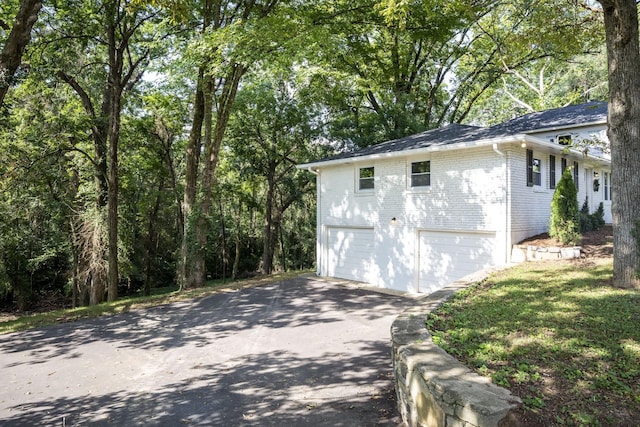 view of property exterior with a garage