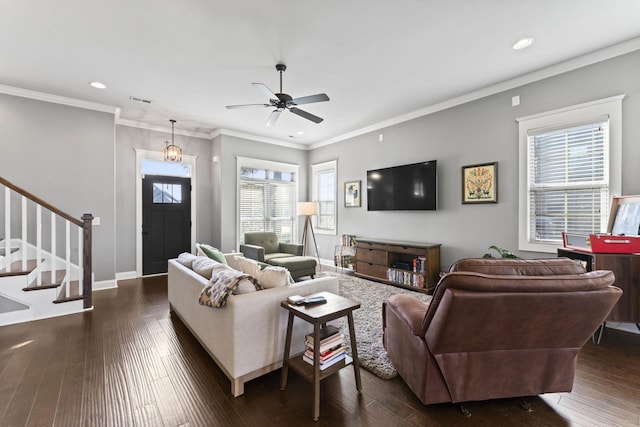 living room featuring dark hardwood / wood-style flooring, ornamental molding, and ceiling fan