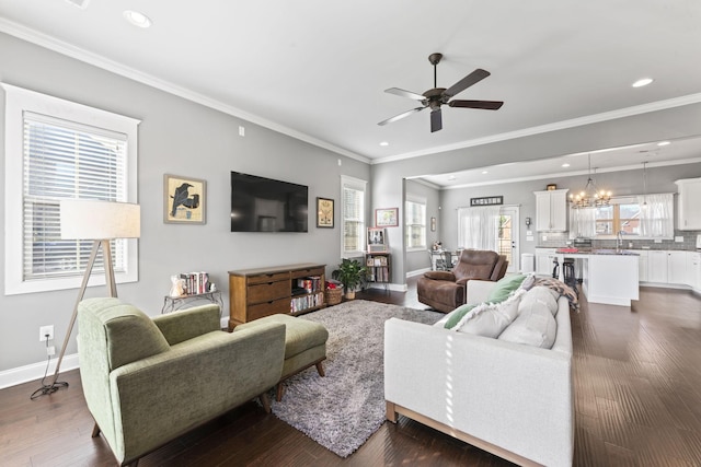 living room featuring sink, ceiling fan with notable chandelier, and dark hardwood / wood-style floors