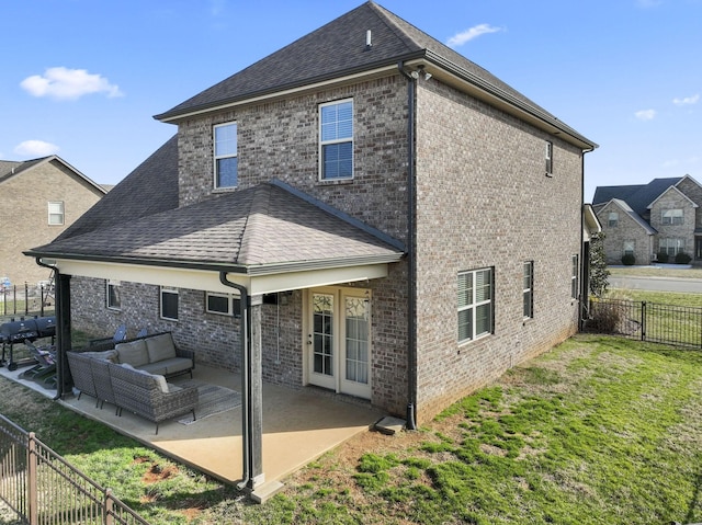 rear view of property with an outdoor hangout area, a yard, and a patio area