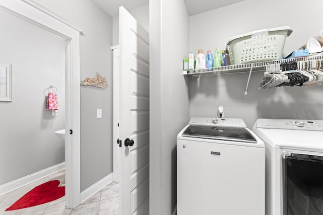 laundry room featuring independent washer and dryer