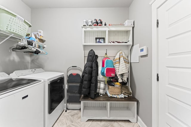 clothes washing area with independent washer and dryer