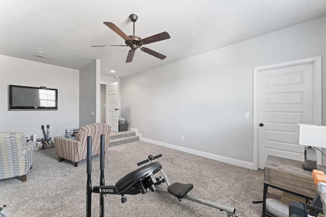 exercise area with carpet floors and ceiling fan