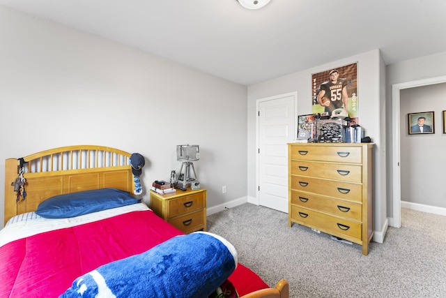 bedroom featuring light colored carpet