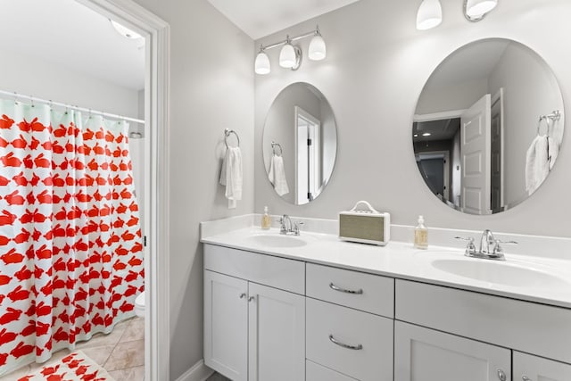 bathroom with vanity and tile patterned flooring