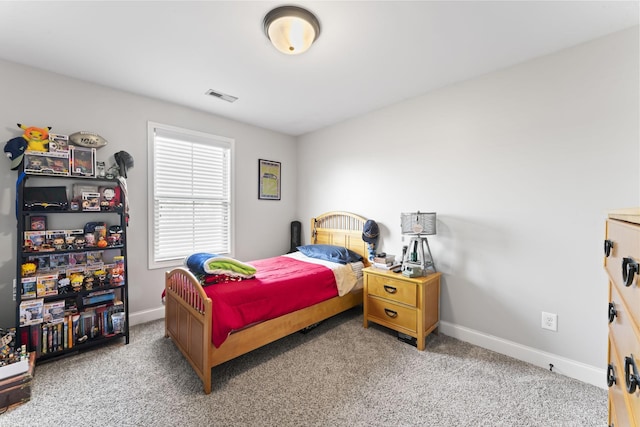 bedroom featuring light colored carpet