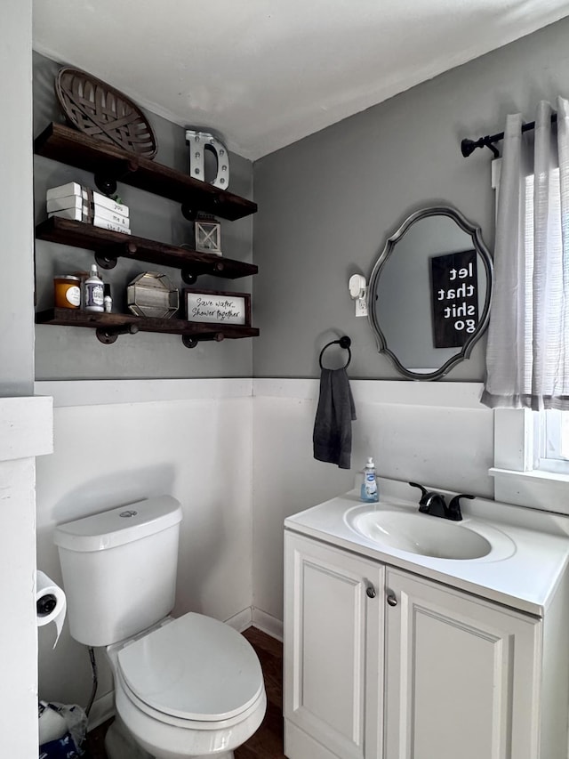 bathroom featuring vanity and toilet