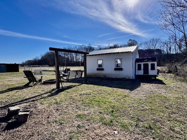 view of home's exterior with an outdoor structure