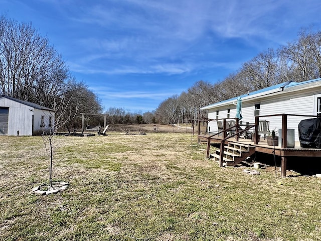 view of yard with a deck