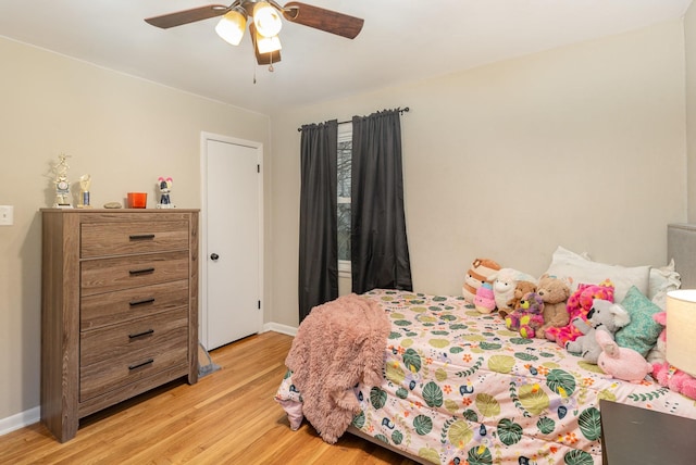 bedroom featuring ceiling fan and light hardwood / wood-style flooring