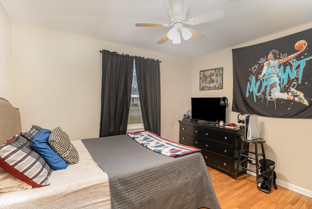 bedroom featuring ceiling fan and light hardwood / wood-style flooring