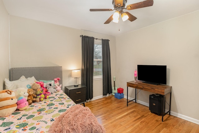 bedroom with light hardwood / wood-style flooring and ceiling fan