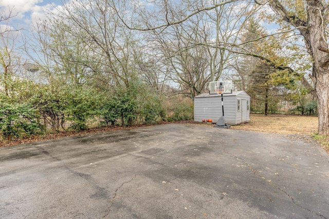 view of patio / terrace featuring a storage shed