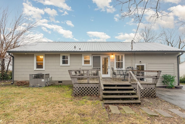 back of house with a wooden deck, a yard, and cooling unit