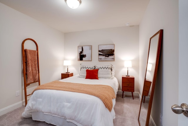 bedroom featuring light colored carpet