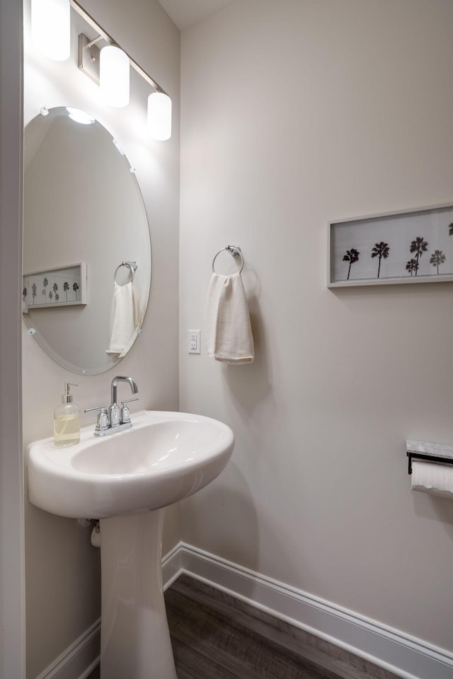 bathroom featuring sink and hardwood / wood-style flooring