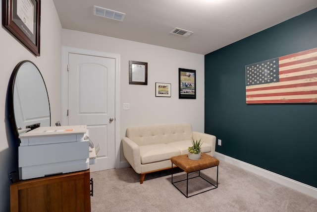 sitting room with light carpet