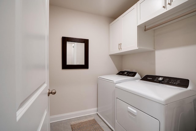 laundry area featuring cabinets and independent washer and dryer