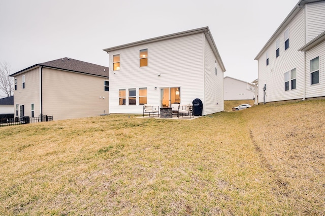 rear view of property with a patio area and a lawn