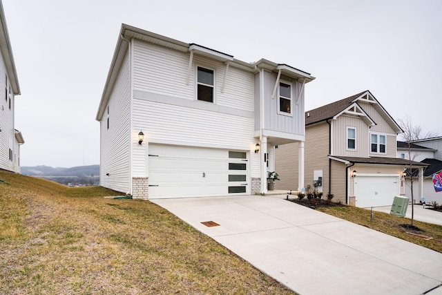 view of front of property with a garage and a front yard