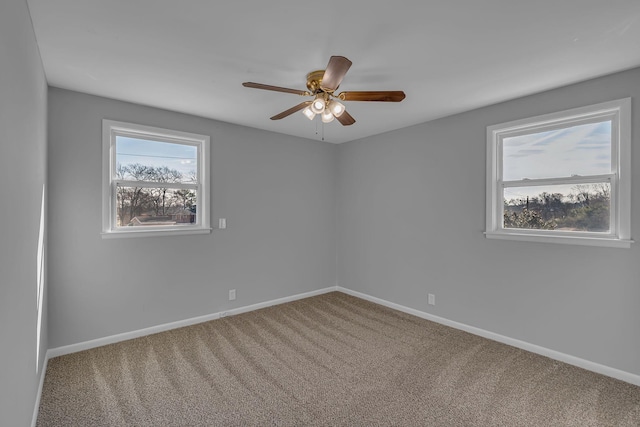 carpeted empty room with ceiling fan