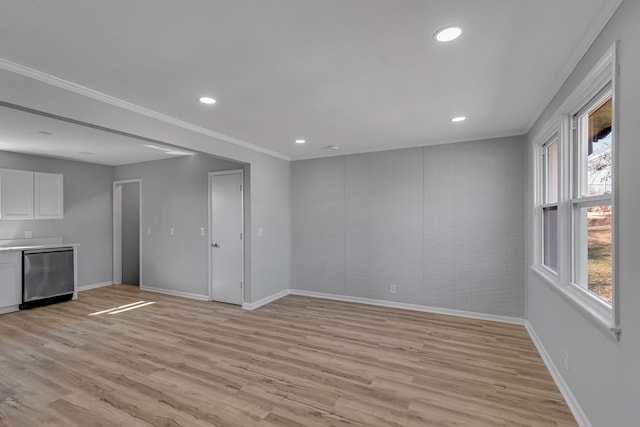 unfurnished living room featuring crown molding and light wood-type flooring