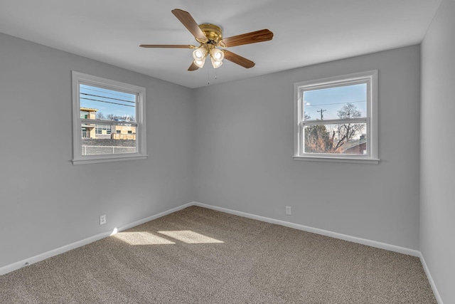 carpeted empty room with ceiling fan