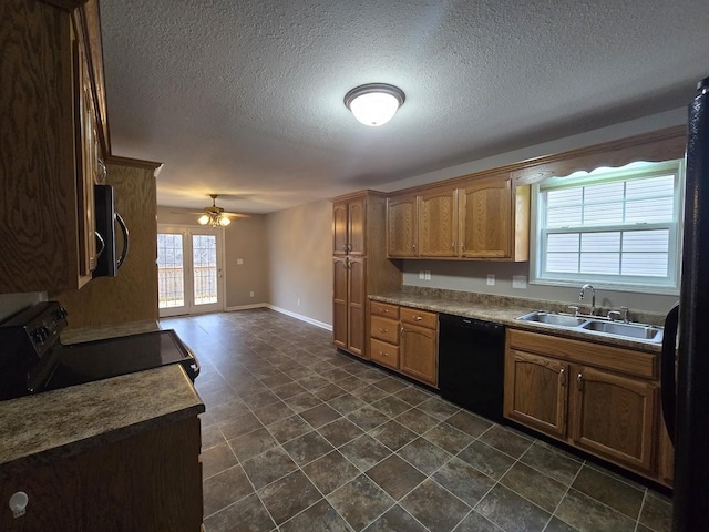 kitchen with sink, a textured ceiling, ceiling fan, and black appliances