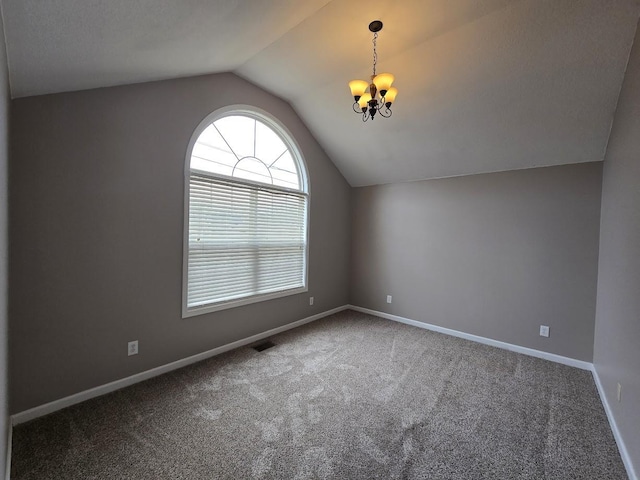 bonus room with lofted ceiling, a notable chandelier, and carpet floors