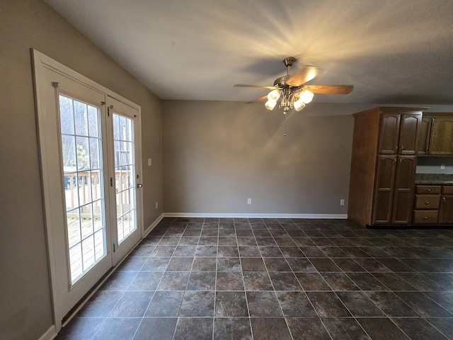 interior space with ceiling fan