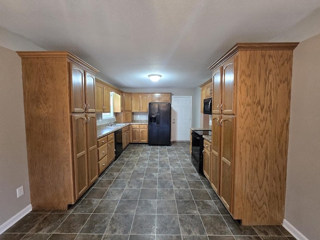 kitchen with sink and black appliances