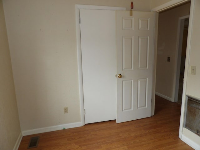 unfurnished bedroom with light hardwood / wood-style flooring