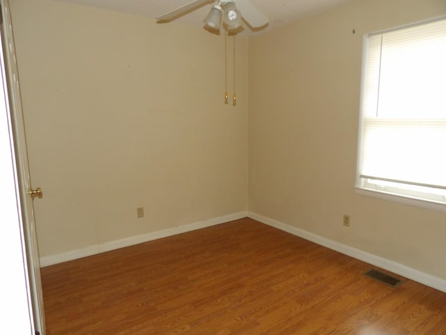 spare room featuring ceiling fan and wood-type flooring