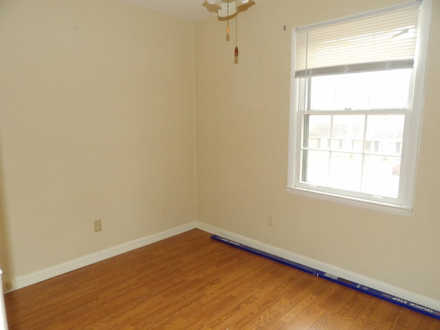 empty room featuring hardwood / wood-style flooring and plenty of natural light