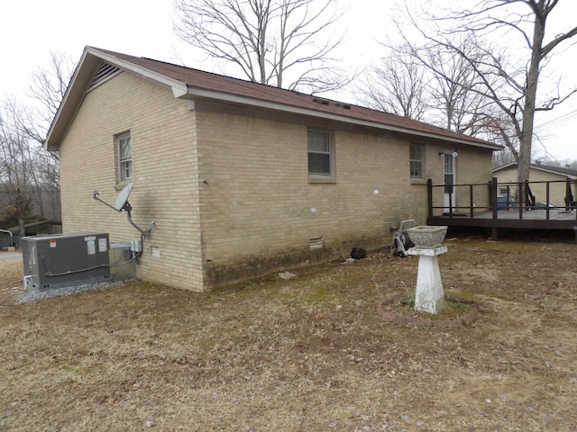 back of property featuring cooling unit and a deck