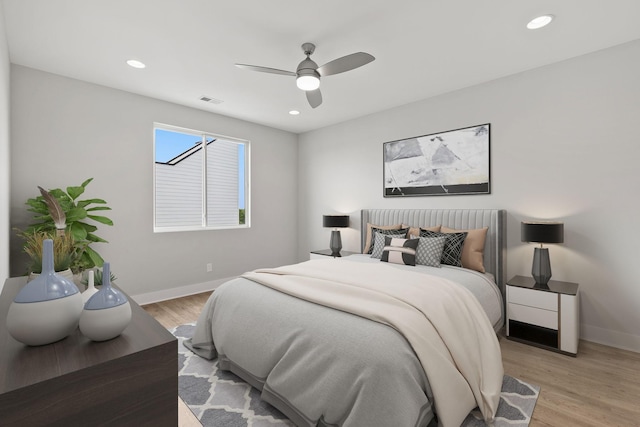 bedroom featuring light hardwood / wood-style flooring and ceiling fan