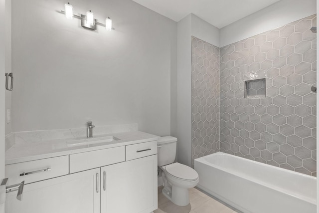 full bathroom with vanity, tiled shower / bath combo, tile patterned floors, and toilet