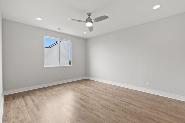 unfurnished room with light hardwood / wood-style flooring and ceiling fan