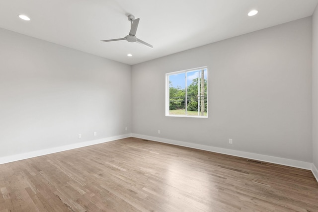 unfurnished room featuring ceiling fan and light wood-type flooring