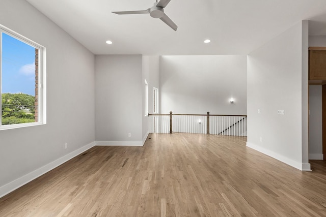 unfurnished living room with ceiling fan and light wood-type flooring