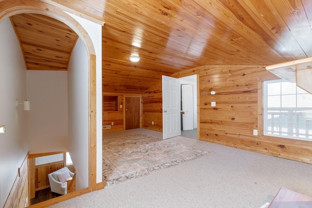 bonus room with lofted ceiling, carpet floors, wood ceiling, and wood walls