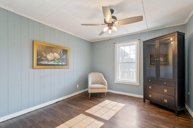 unfurnished room with dark hardwood / wood-style flooring, ornamental molding, and ceiling fan