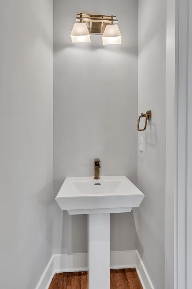 bathroom featuring hardwood / wood-style flooring and sink