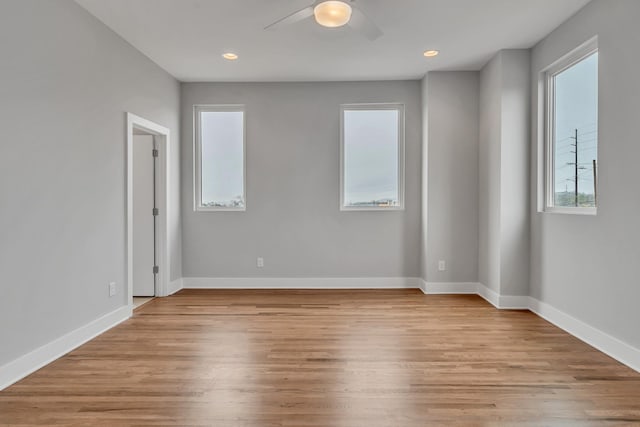 unfurnished room featuring light hardwood / wood-style floors and ceiling fan