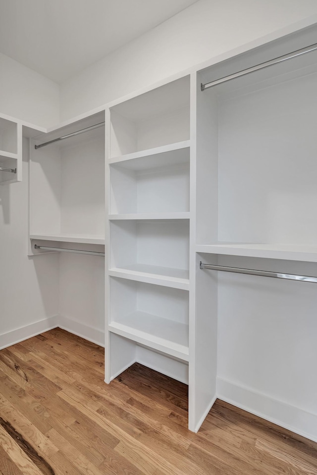 walk in closet featuring wood-type flooring