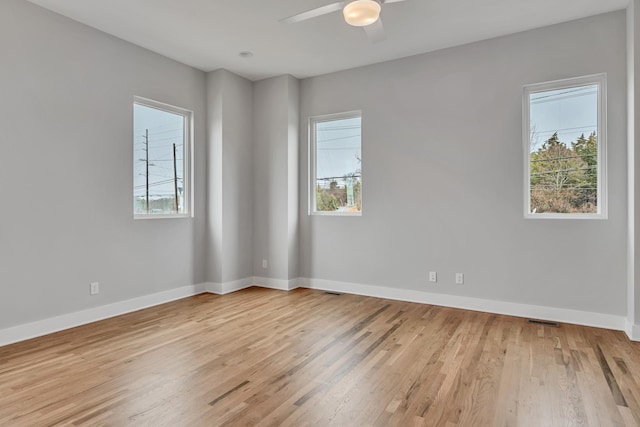 spare room with ceiling fan and light hardwood / wood-style floors