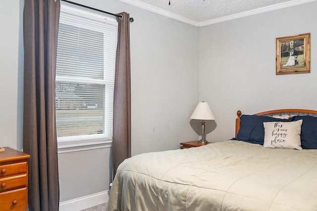 bedroom featuring crown molding and a textured ceiling