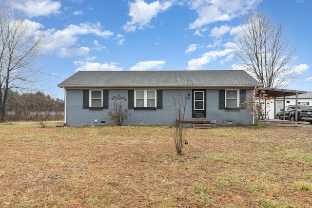 ranch-style home with a carport and a front yard